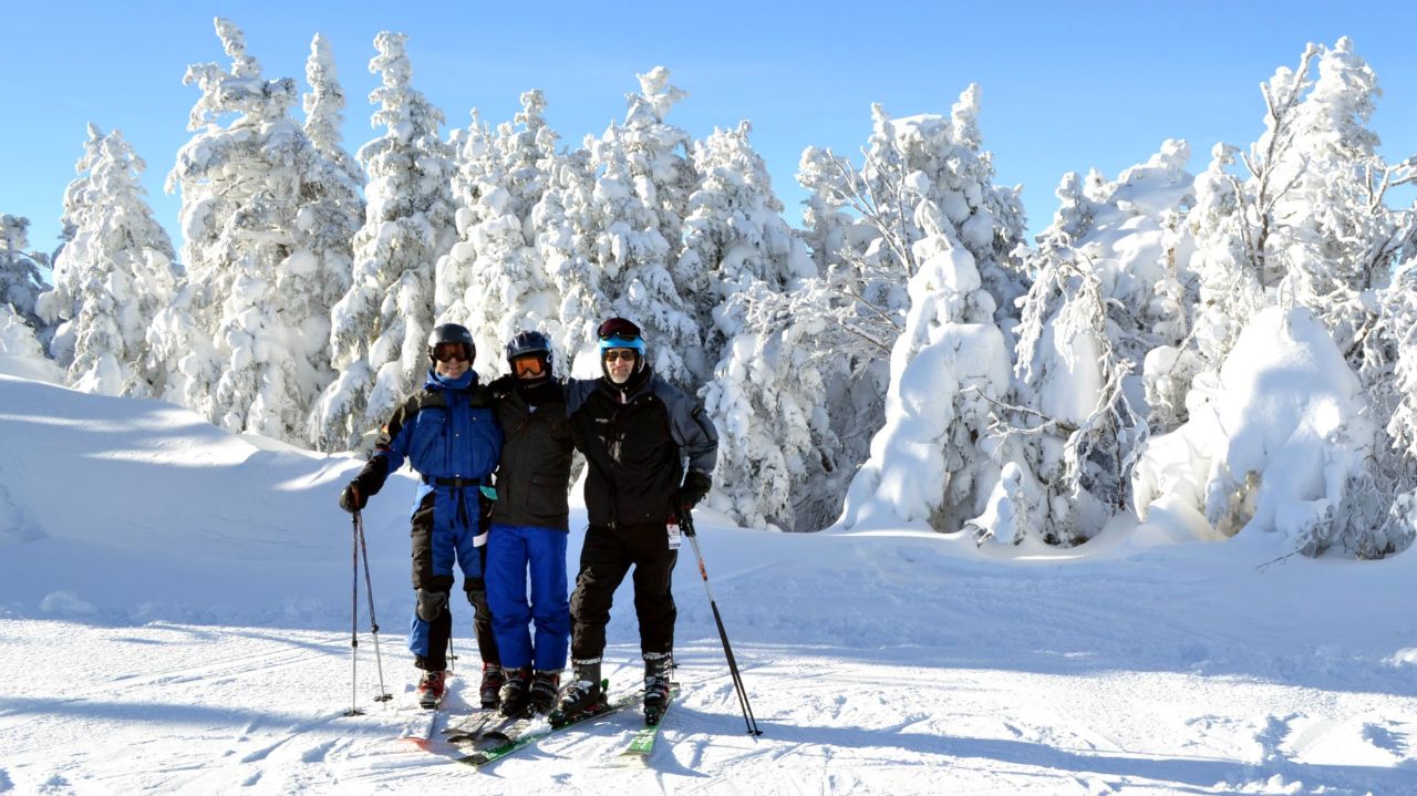 From left, Paul Kafka-Gibbons, Julian Kafka, and Richard Wood at the top of Cannon Mountain.